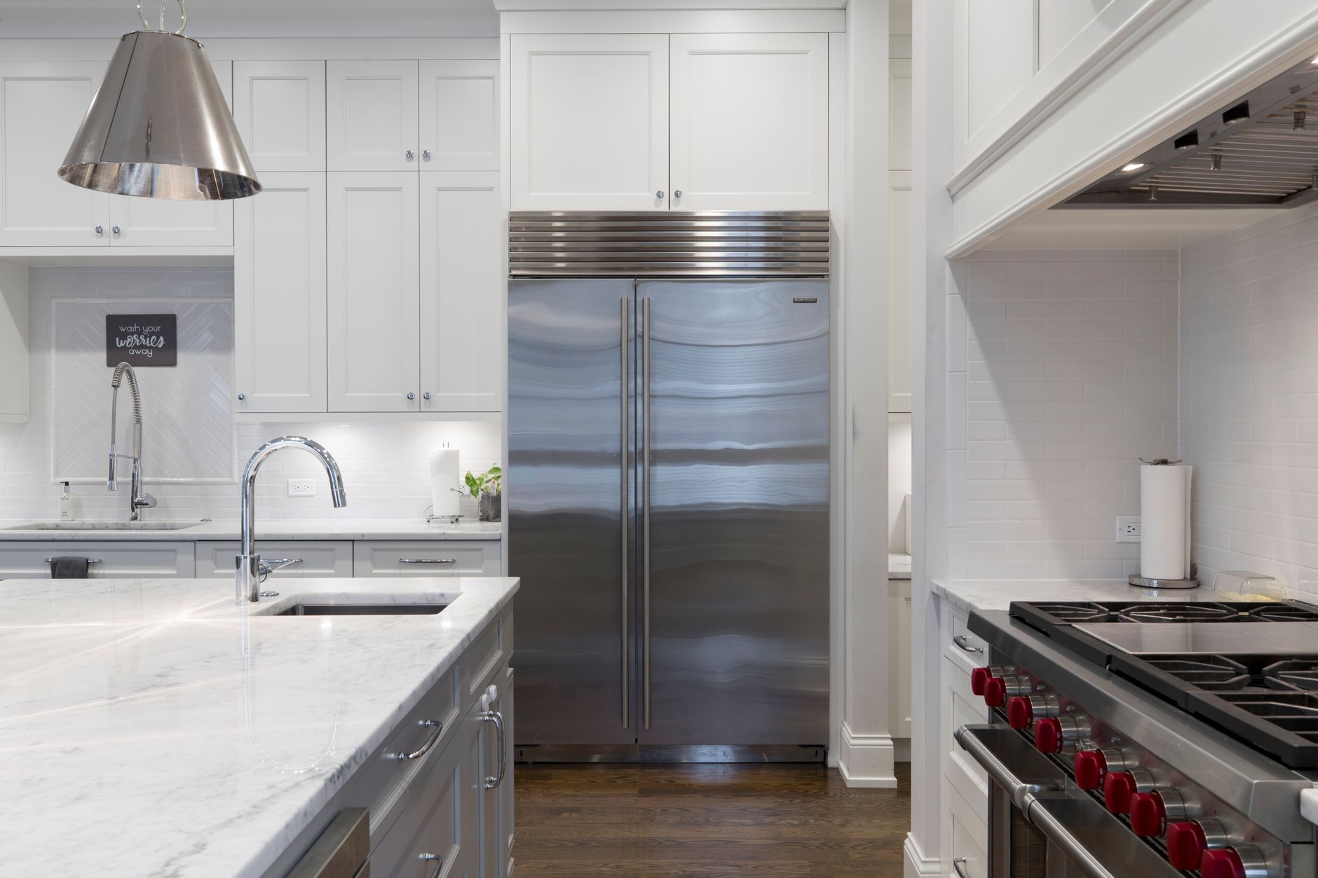 A sleek modern kitchen featuring stainless steel appliances and marble countertops in Riverside, CA